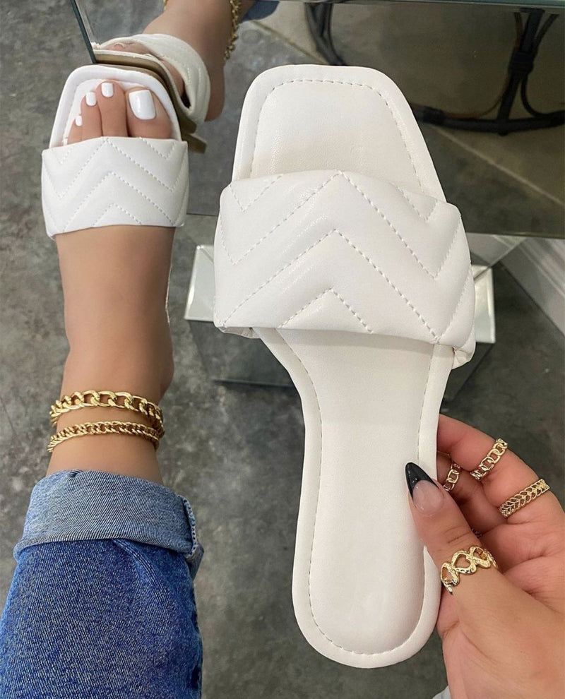 Women's flat quilted slide sandals